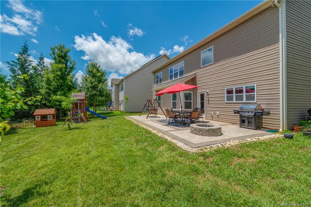 290 Fischer Road Fort Mill, SC 29715 - Photo 29 of 35 a patio with a table and chairs and potted plants