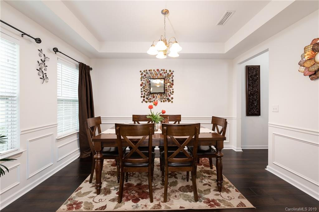 290 Fischer Road Fort Mill, SC 29715 - Photo 7 of 35 a view of a dining room with furniture and wooden floor