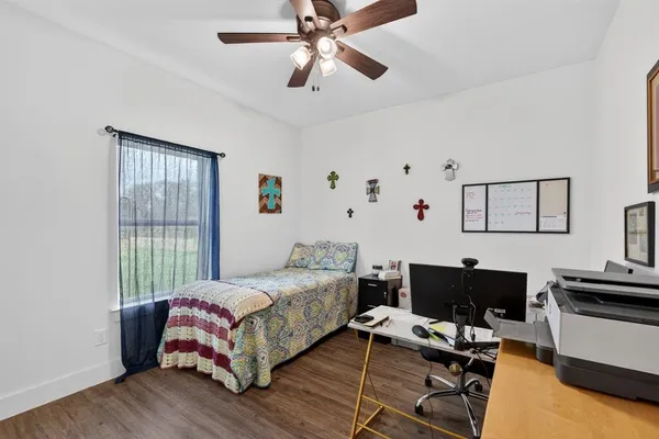 an aerial view of a house with a yard basket ball court and outdoor seating