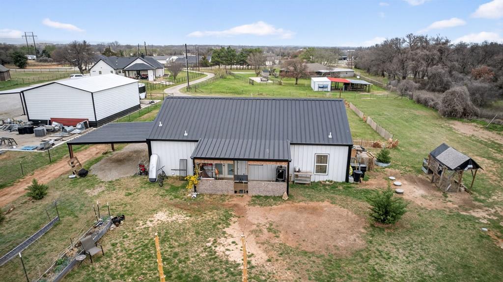 2225 West J E Woody Road Springtown, TX 76082 - Photo 24 of 29 an aerial view of a house with a yard basket ball court and outdoor seating