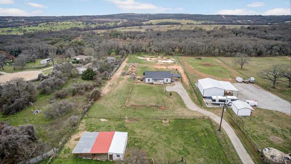 2225 West J E Woody Road Springtown, TX 76082 - Photo 25 of 29 a view of a lake with a yard