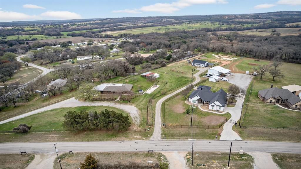 2225 West J E Woody Road Springtown, TX 76082 - Photo 28 of 29 an aerial view of a house