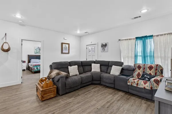 a bedroom with a bed and a dresser