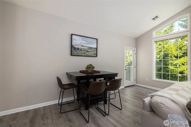 a view of a dining room with furniture window and outside view