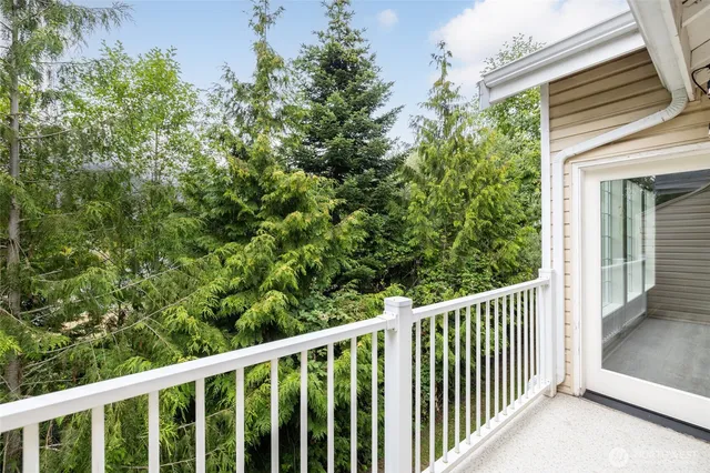 a view of a balcony with wooden floor