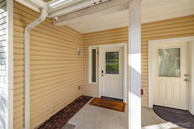 a view of a door and a window