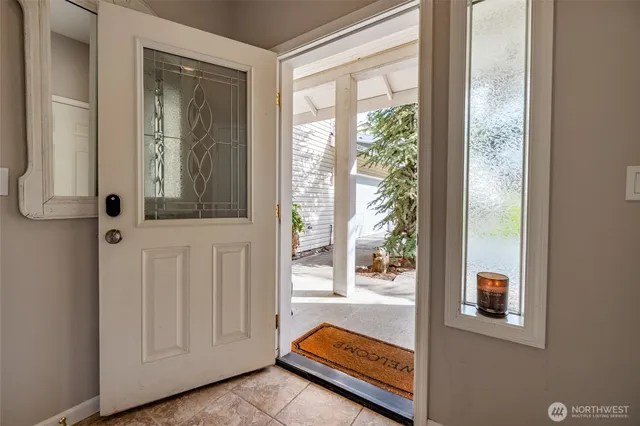 a view of front door with a bench