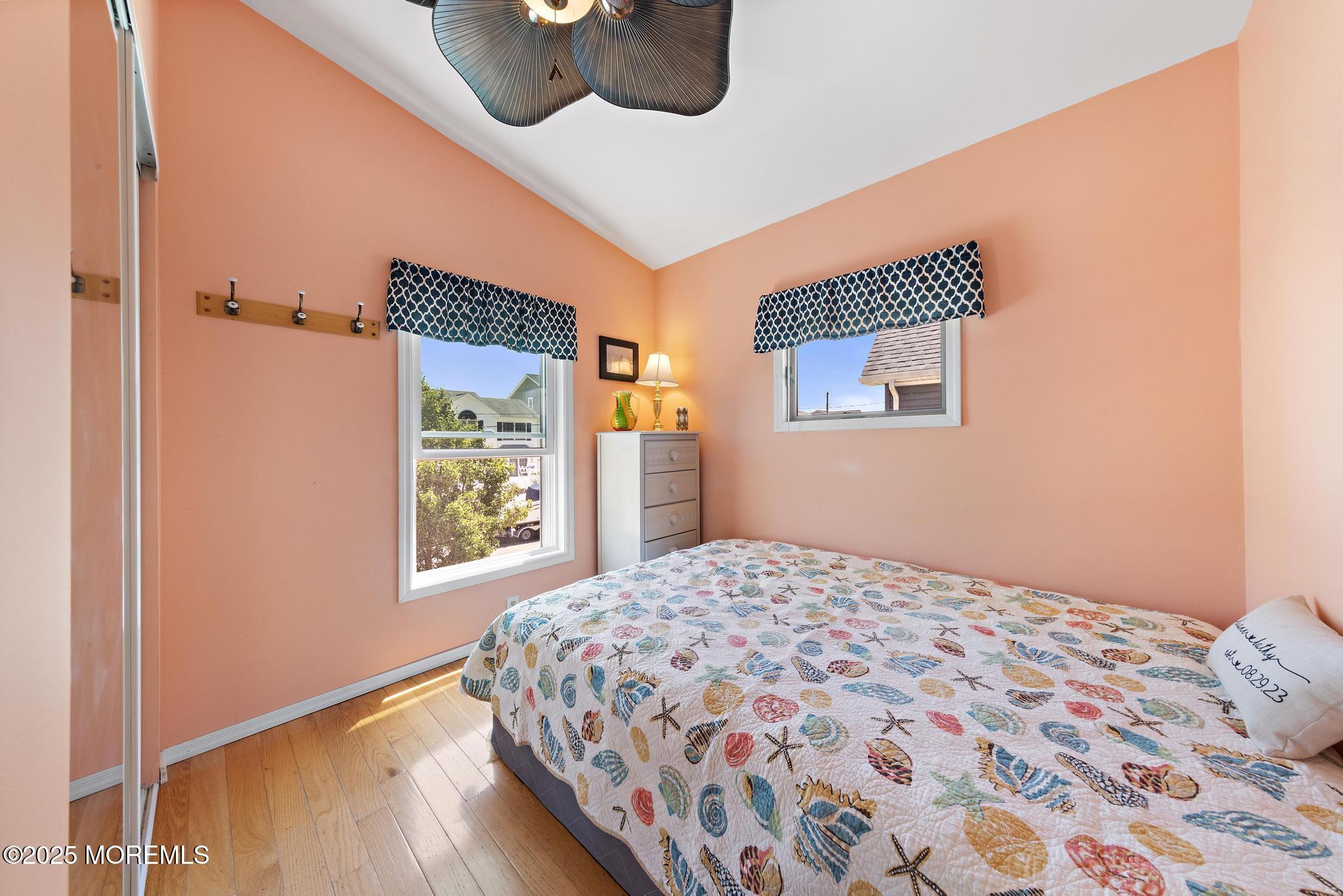 68 Patrick Drive Beach Haven West, NJ 08050 - Photo 13 of 16 a bedroom with a bed and a window