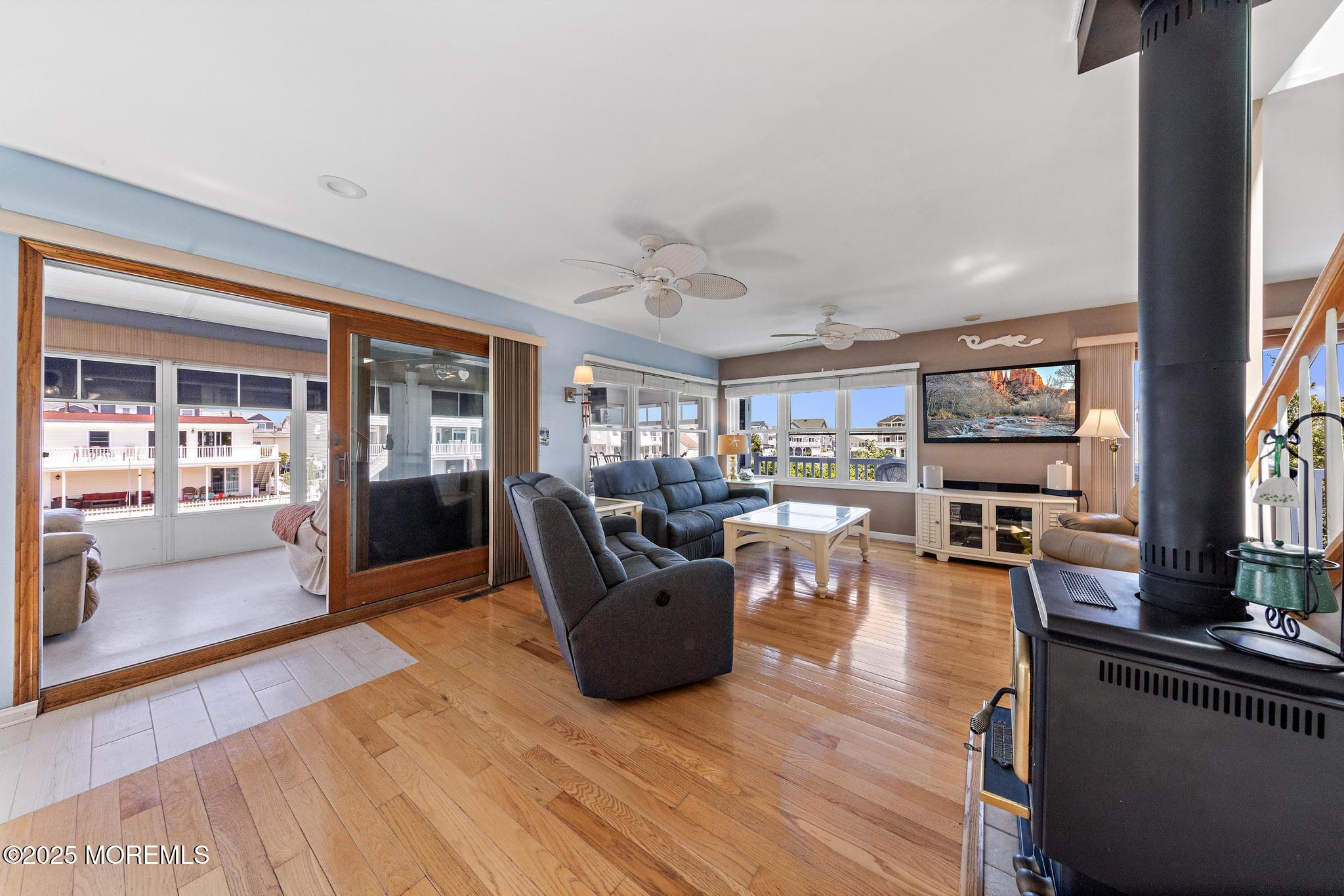 68 Patrick Drive Beach Haven West, NJ 08050 - Photo 3 of 16 a living room with furniture and a flat screen tv