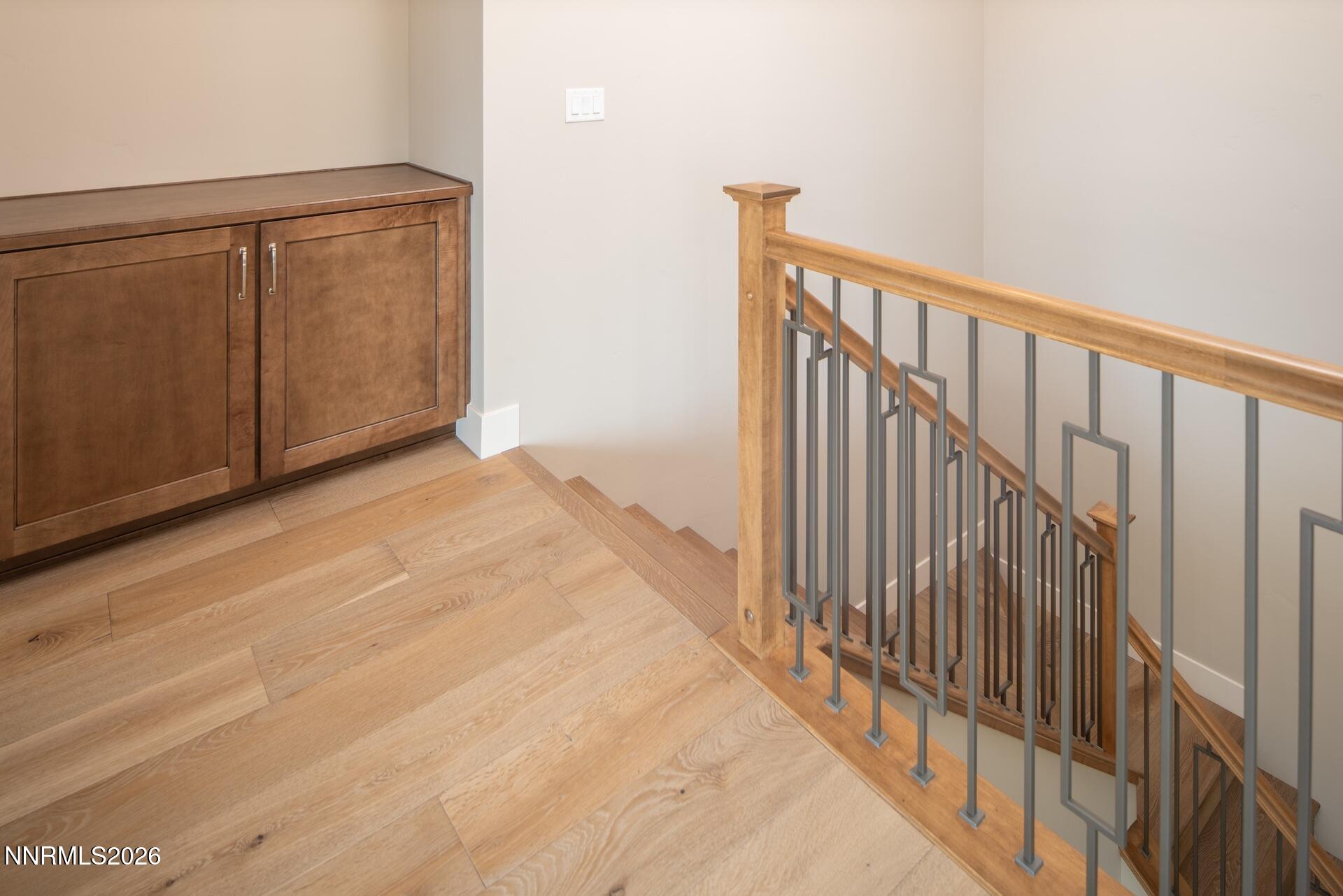 2241 Cold Creek Trail Reno, NV 89523 - Photo 26 of 40 a view of a hallway with wooden floor