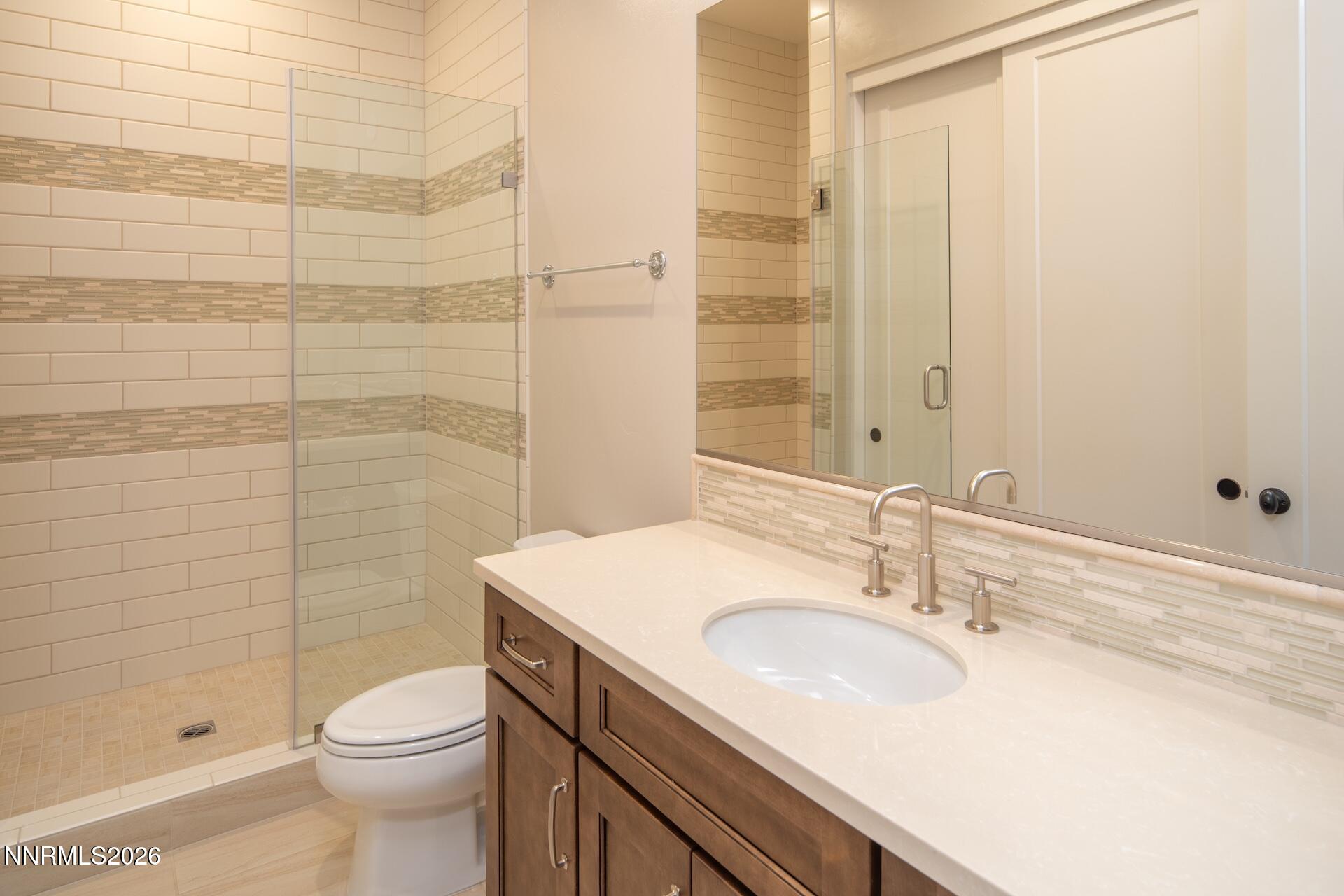 2241 Cold Creek Trail Reno, NV 89523 - Photo 29 of 40 a bathroom with a sink a toilet and shower