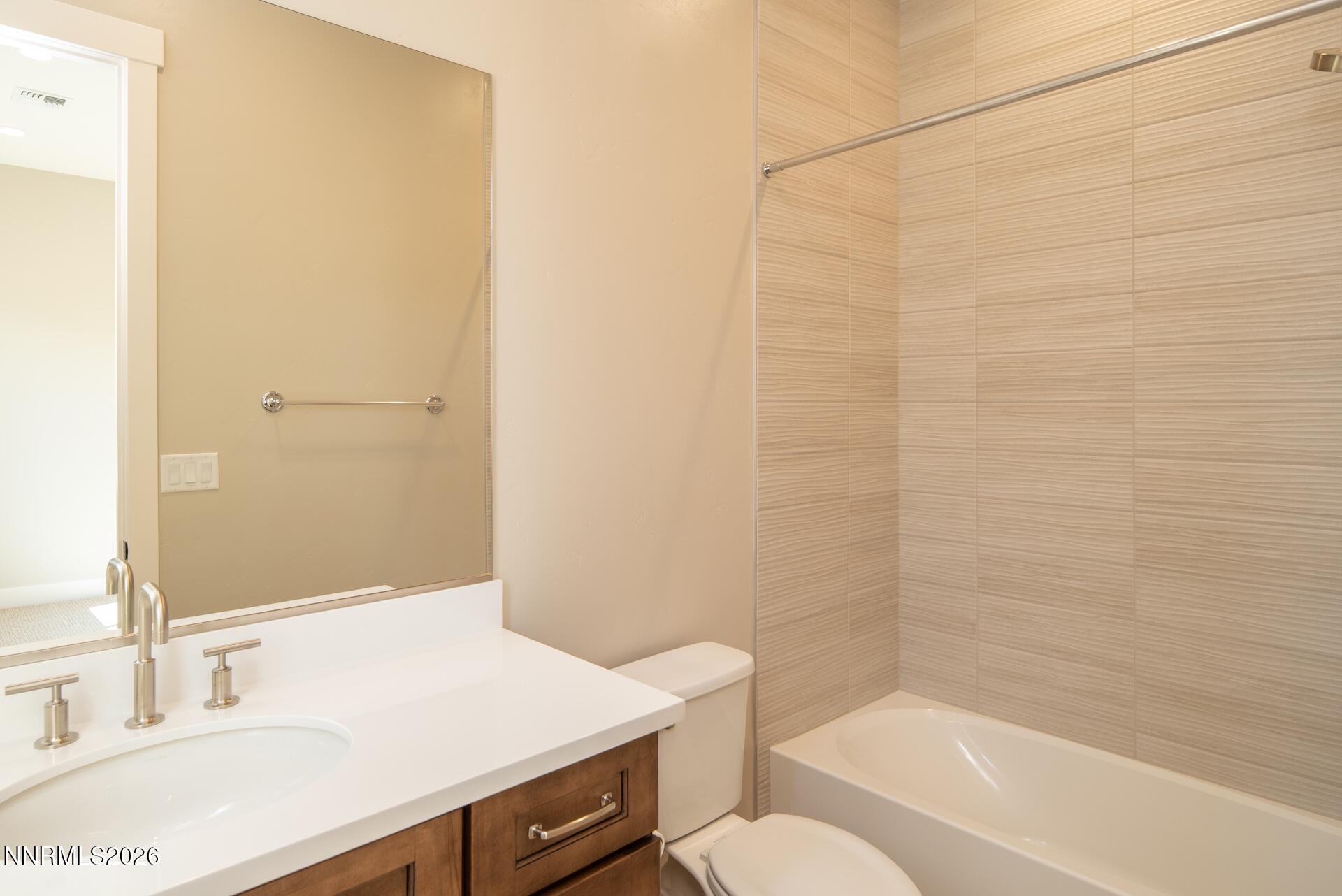 2241 Cold Creek Trail Reno, NV 89523 - Photo 30 of 40 a bathroom with a sink a toilet and shower