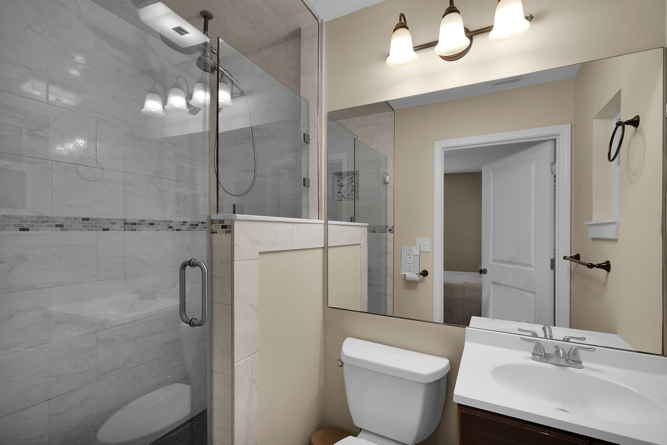 141 Argonaut Road St. Augustine, FL 32086 - Photo 18 of 27 a bathroom with a sink toilet and shower