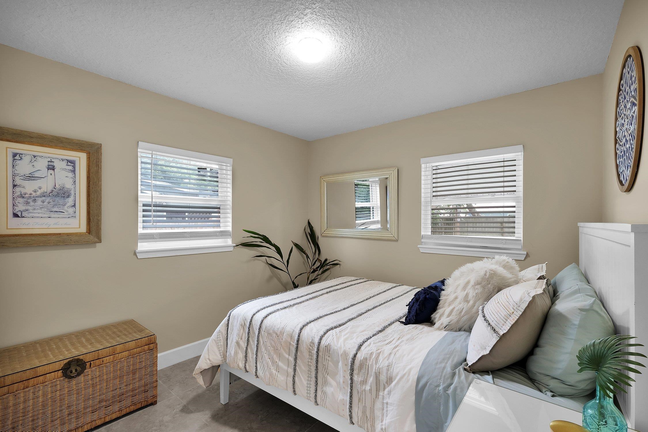 141 Argonaut Road St. Augustine, FL 32086 - Photo 20 of 27 a bedroom with a bed and a window