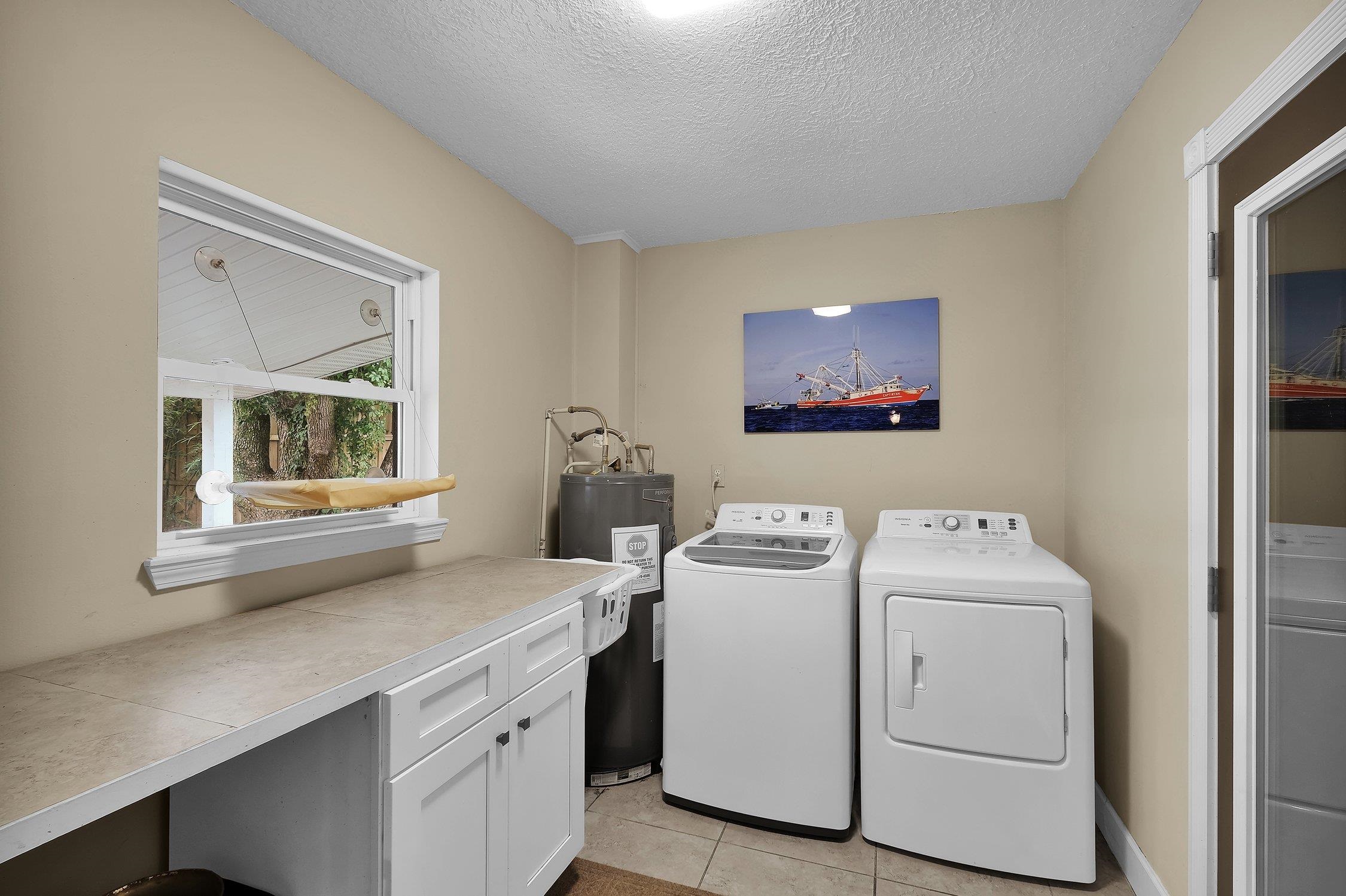 141 Argonaut Road St. Augustine, FL 32086 - Photo 22 of 27 a utility room with dryer and washer