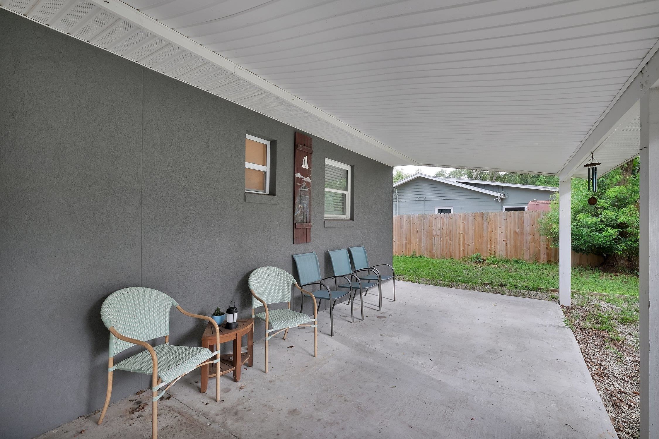 141 Argonaut Road St. Augustine, FL 32086 - Photo 23 of 27 a backyard of a house with table and chairs