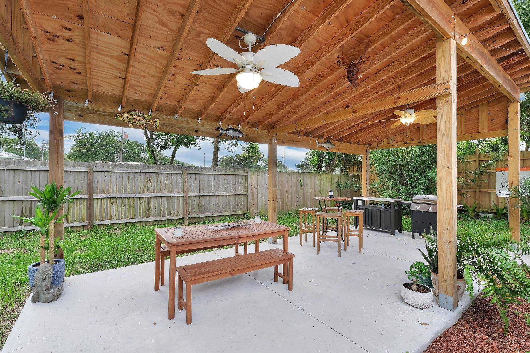 141 Argonaut Road St. Augustine, FL 32086 - Photo 26 of 27 a view of a patio with a table and chairs