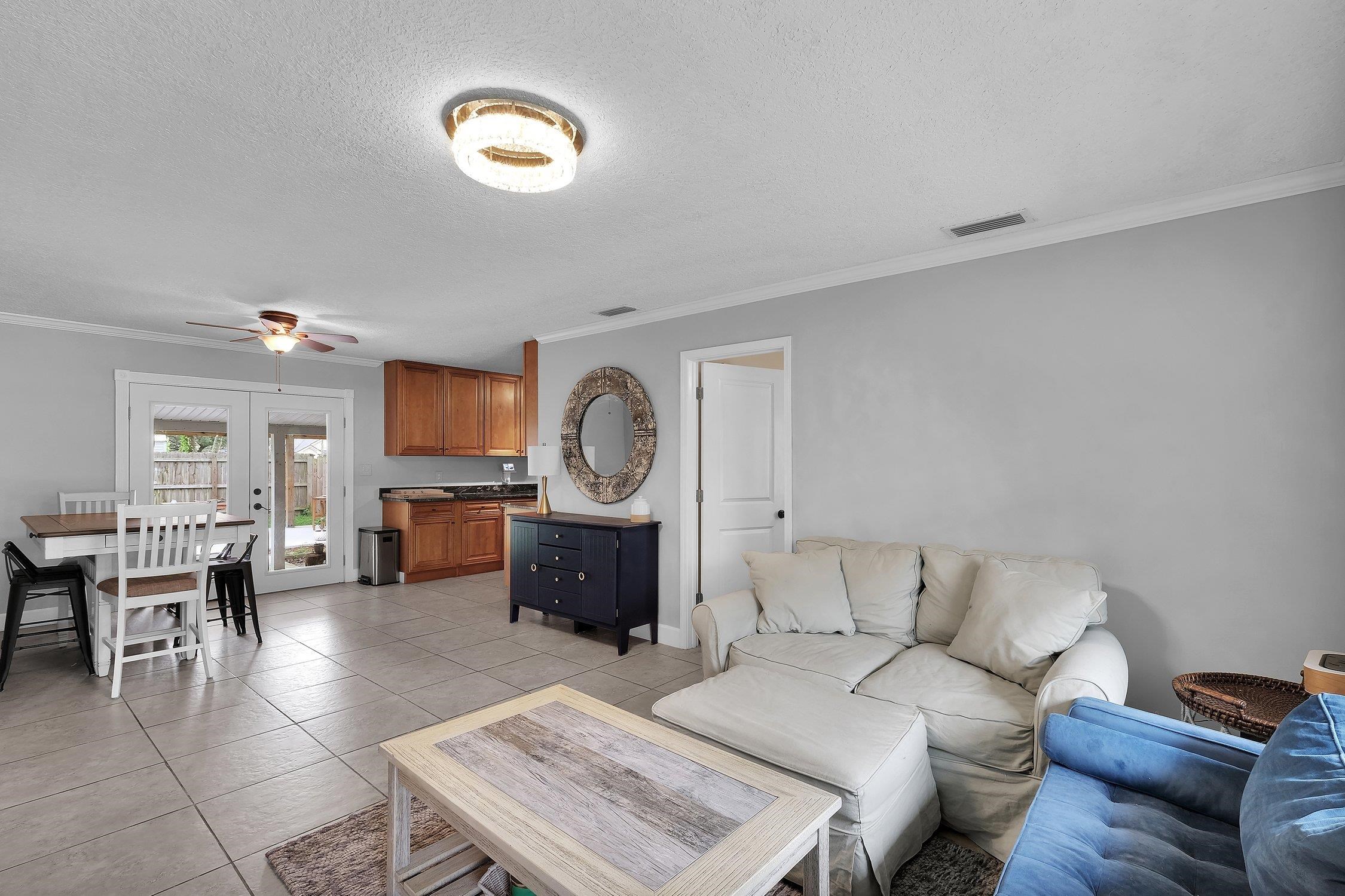 141 Argonaut Road St. Augustine, FL 32086 - Photo 6 of 27 a living room with furniture a couch and kitchen view
