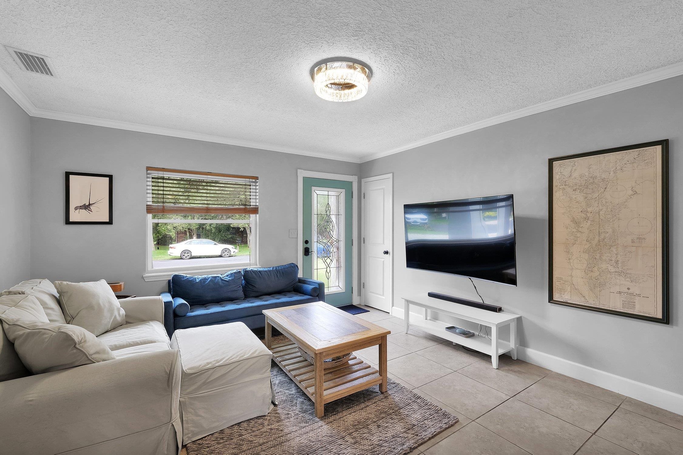 141 Argonaut Road St. Augustine, FL 32086 - Photo 8 of 27 a living room with furniture and a flat screen tv