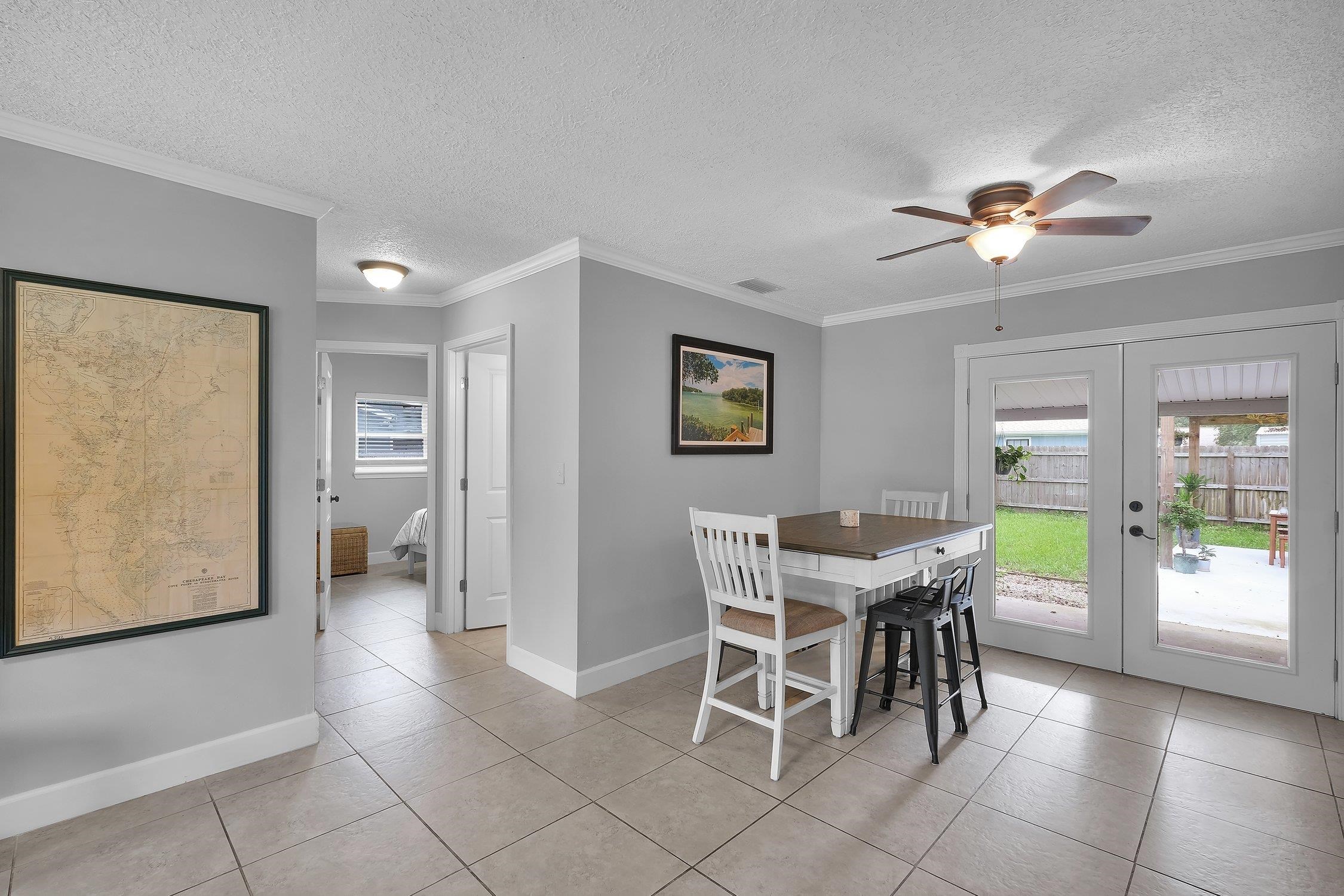 141 Argonaut Road St. Augustine, FL 32086 - Photo 9 of 27 a view of a dining room with furniture and a chandelier