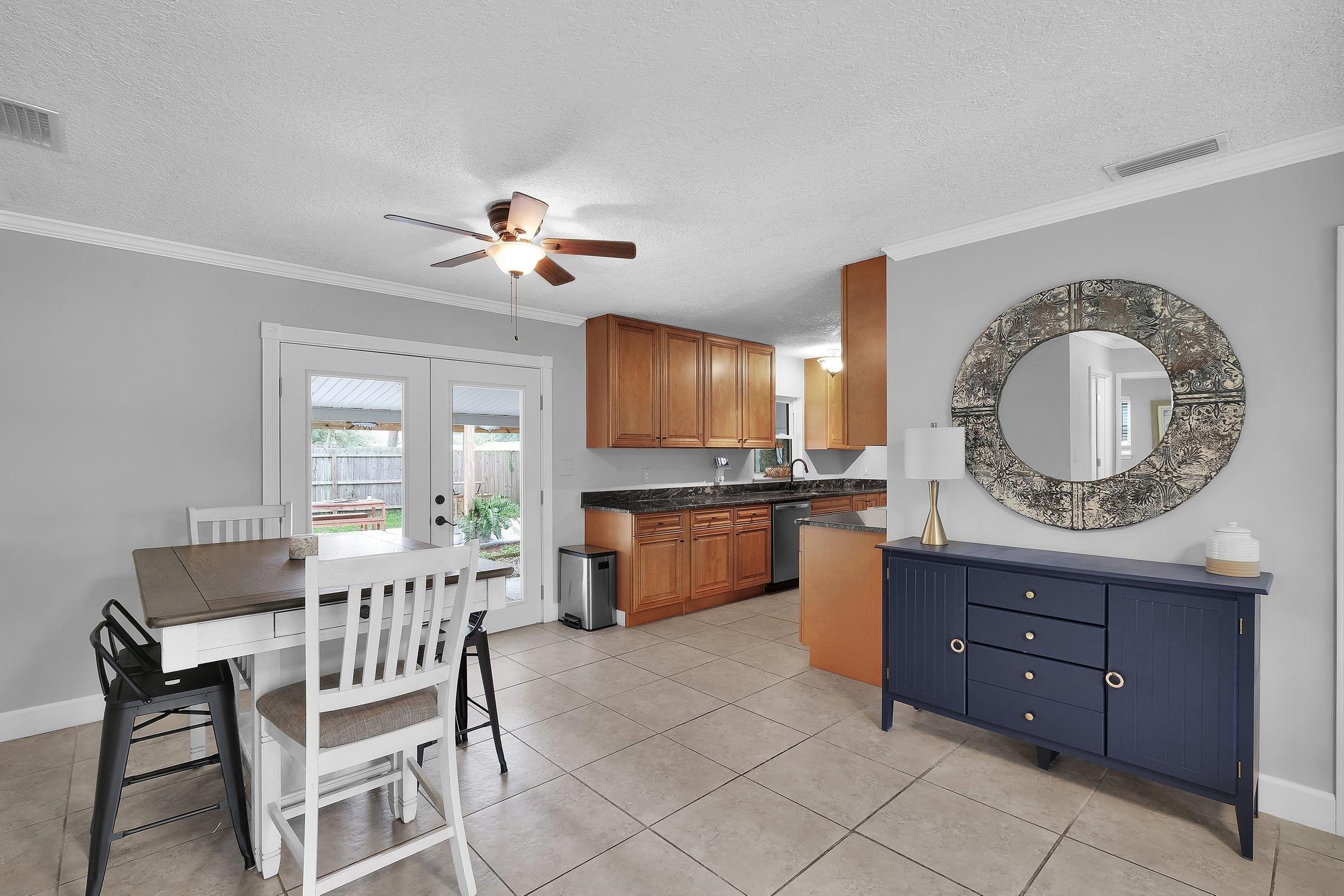 141 Argonaut Road St. Augustine, FL 32086 - Photo 10 of 27 a living room with a couch and a chandelier