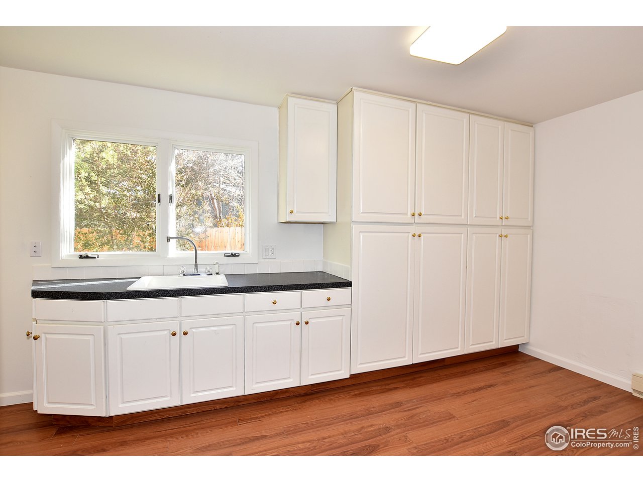 1402 Wildwood Road Fort Collins, CO 80521 - Photo 24 of 26 Large laundry area with tons of storage!