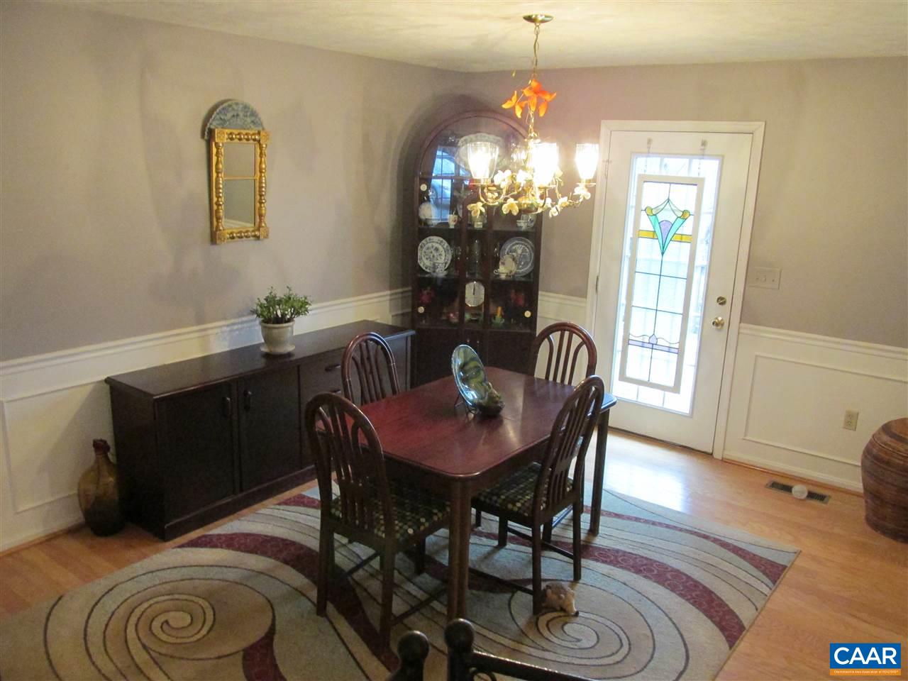 688 Carnation Road Ruckersville, VA 22968 - Photo 3 of 25 a view of a dining room with furniture and chandelier