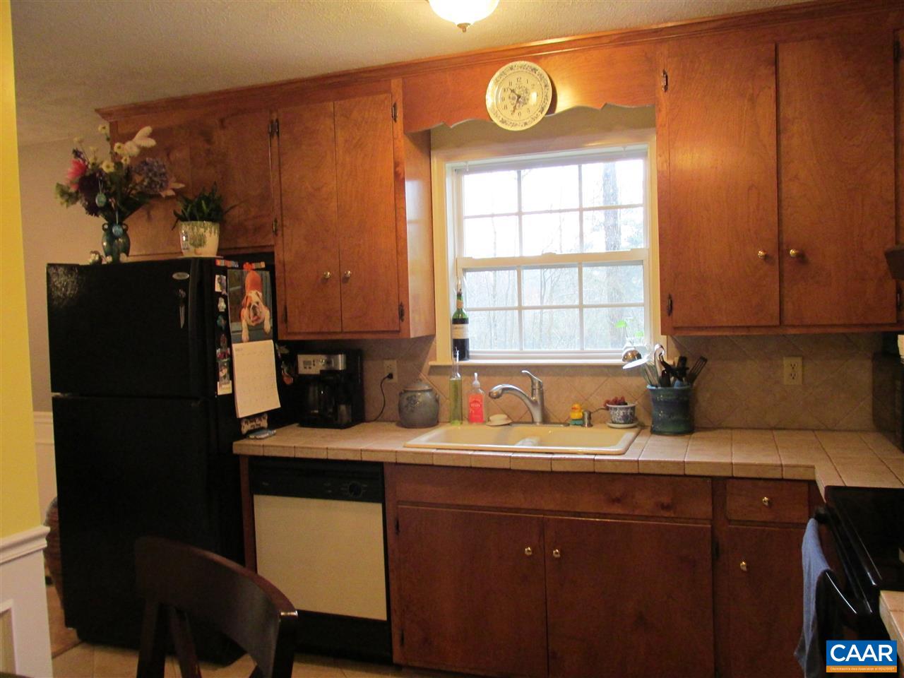 688 Carnation Road Ruckersville, VA 22968 - Photo 5 of 25 a kitchen with a sink cabinets and window