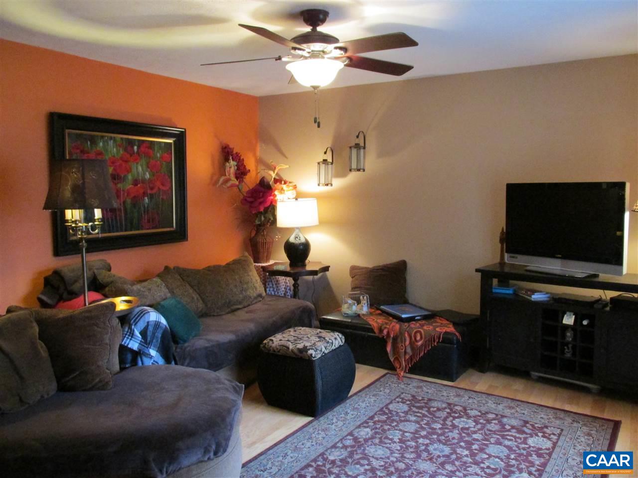 688 Carnation Road Ruckersville, VA 22968 - Photo 7 of 25 a living room with furniture and a flat screen tv