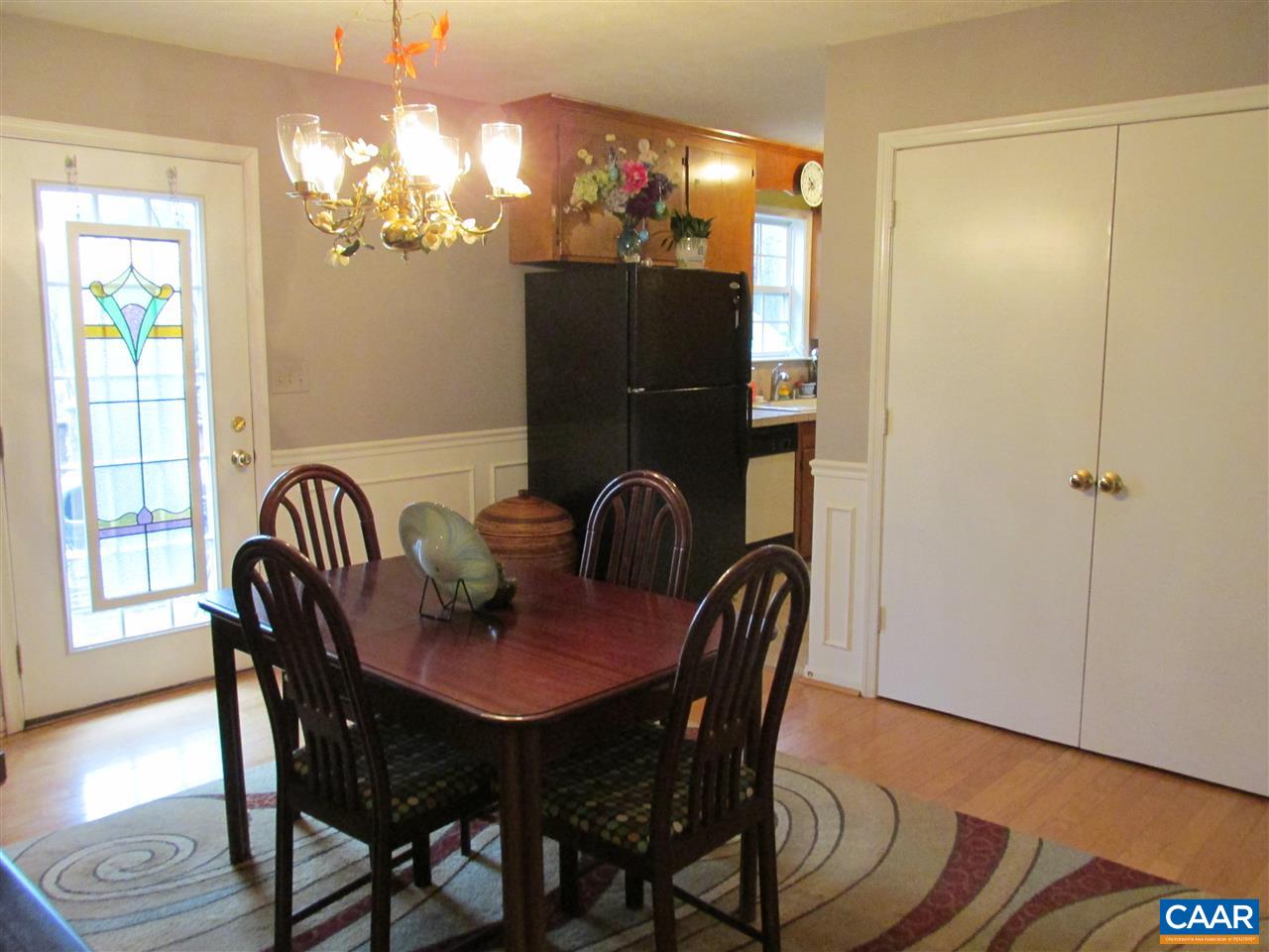 688 Carnation Road Ruckersville, VA 22968 - Photo 8 of 25 a view of a dining room with furniture and chandelier