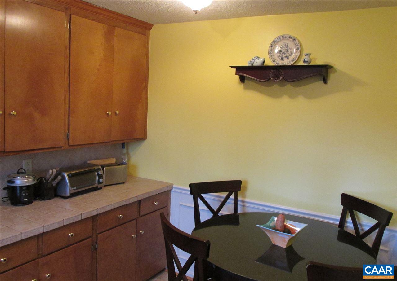 688 Carnation Road Ruckersville, VA 22968 - Photo 9 of 25 a kitchen with a sink and cabinets