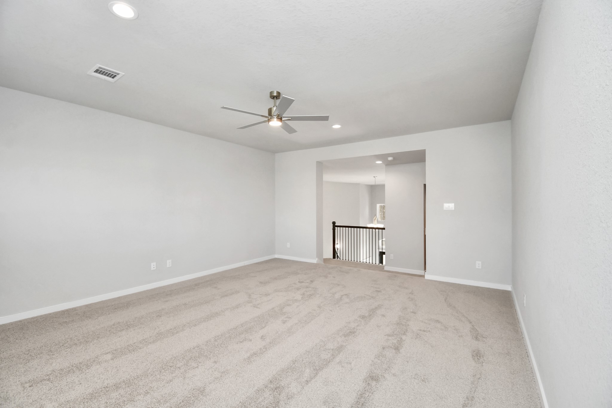 3106 Native Spg Drive Spring, TX 77373 - Photo 26 of 38 Come upstairs and enjoy a day of leisure in this fabulous game room! This is the perfect hangout spot or adult game room! Features plush carpet, high ceilings, custom paint and windows for plenty of natural light. Sample photo of completed home with similar floor plan. Actual colors and selections may vary.