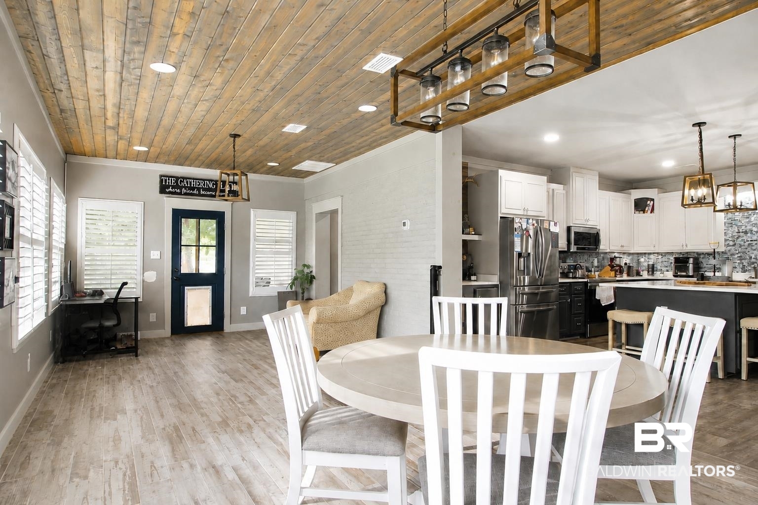 9825 Wolf Creek Ridge Elberta, AL 36530 - Photo 26 of 76 Open-concept living space with wood-finish flooring and a plank wood ceiling