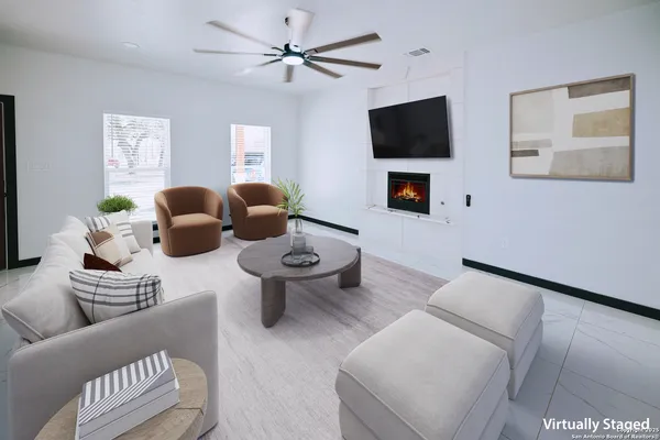 a living room with furniture and a flat screen tv