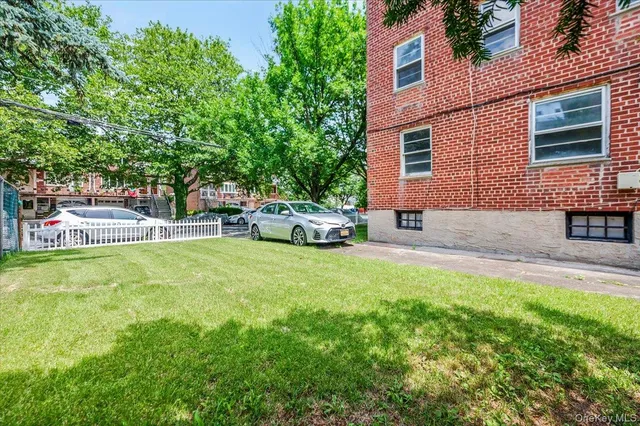 a view of a house with wooden fence