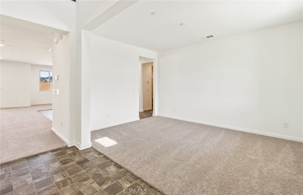 784 Sawgrass Street Perris, CA 92571 - Photo 16 of 46 a view of a room with a hallway