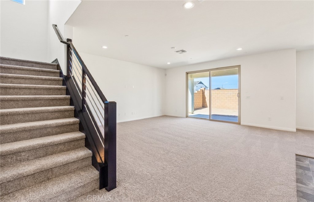 784 Sawgrass Street Perris, CA 92571 - Photo 26 of 46 a view of an empty room with stairs