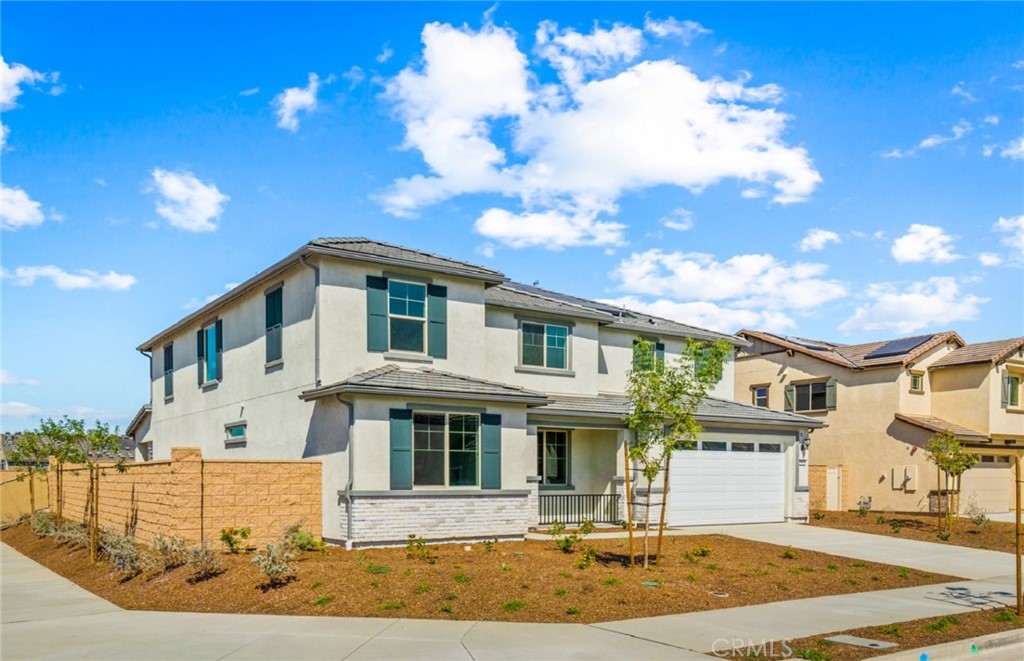784 Sawgrass Street Perris, CA 92571 - Photo 2 of 46 a front view of a house with a yard