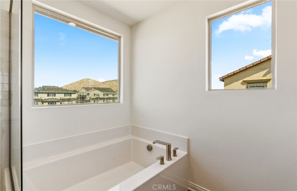 784 Sawgrass Street Perris, CA 92571 - Photo 33 of 46 a white bath tub sitting next to a window