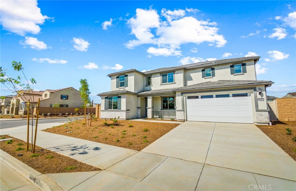 784 Sawgrass Street Perris, CA 92571 - Photo 3 of 46 a front view of a house with garden