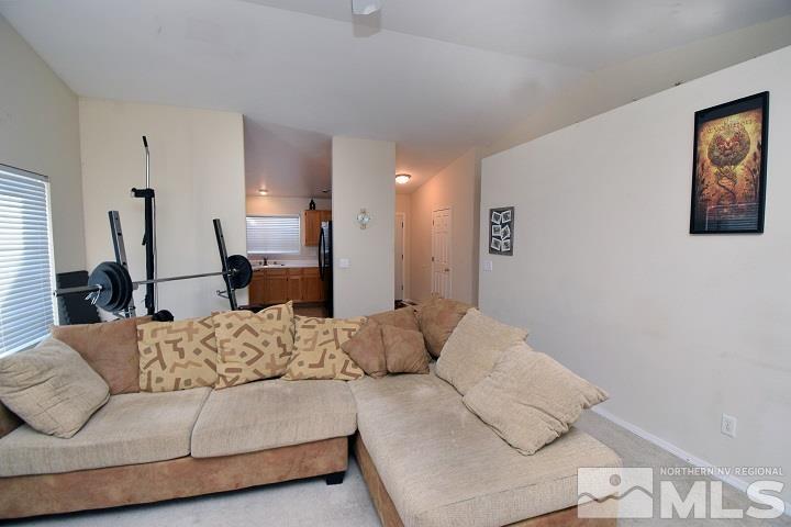 4755 Goodwin Road Sparks, NV 89436 - Photo 11 of 38 a living room with furniture and a wooden floor