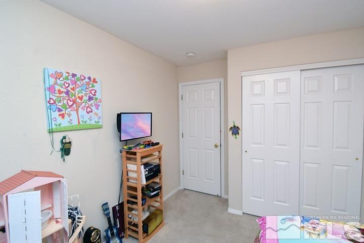 4755 Goodwin Road Sparks, NV 89436 - Photo 14 of 38 a view of room with toys and closet