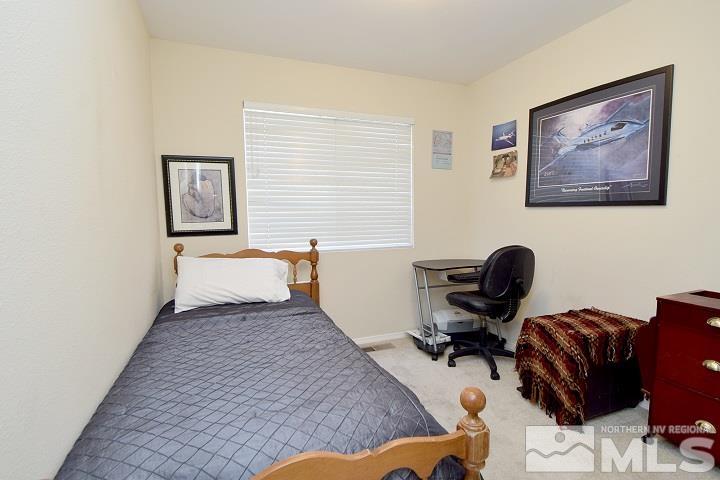 4755 Goodwin Road Sparks, NV 89436 - Photo 16 of 38 a workspace with furniture and a window