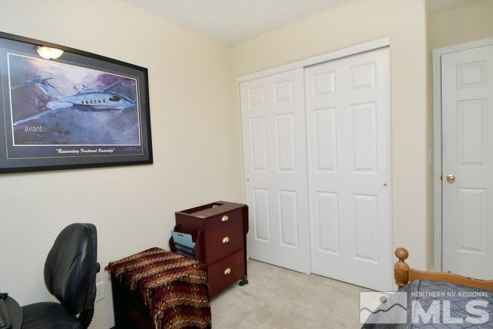 4755 Goodwin Road Sparks, NV 89436 - Photo 17 of 38 a view of room with workspace and a painting