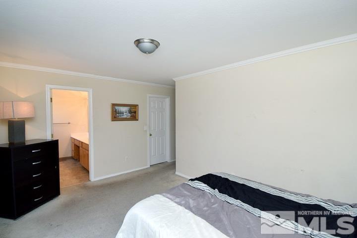 4755 Goodwin Road Sparks, NV 89436 - Photo 19 of 38 a bedroom with a bed and a dresser