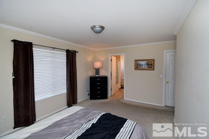 4755 Goodwin Road Sparks, NV 89436 - Photo 20 of 38 a bedroom with a bed and a cabinets