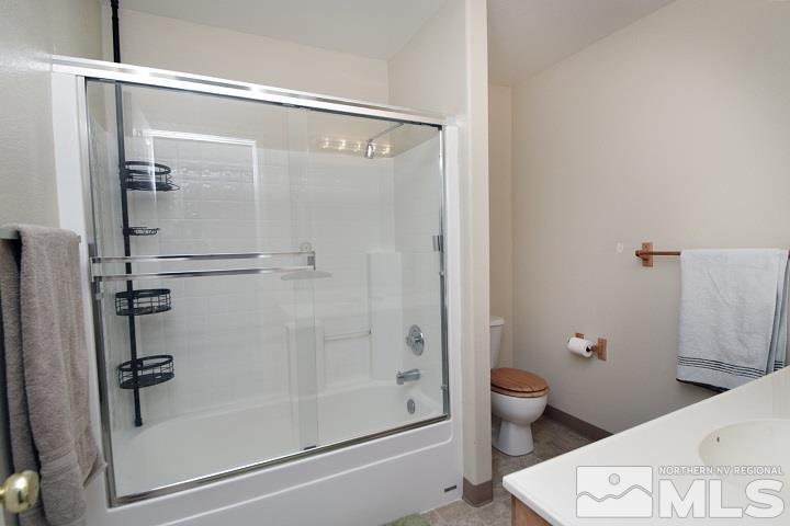 4755 Goodwin Road Sparks, NV 89436 - Photo 21 of 38 a bathroom with a shower and a toilet