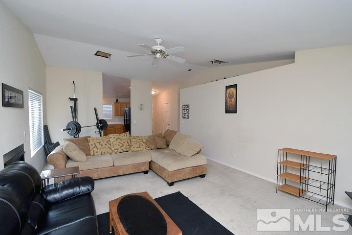 4755 Goodwin Road Sparks, NV 89436 - Photo 9 of 38 a living room with furniture and a mirror
