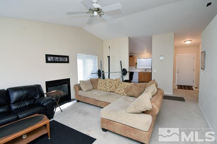 4755 Goodwin Road Sparks, NV 89436 - Photo 10 of 38 a living room with furniture and a fireplace