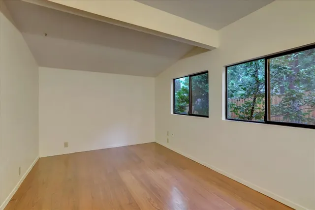 a view of a hallway with furniture and front door